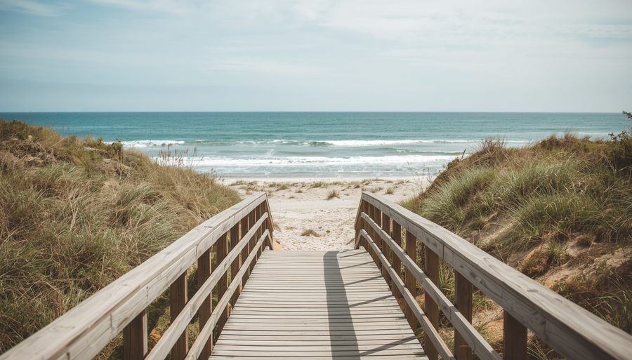 Gentle ocean waves flowing over smooth stones — therapy moving at the pace of the person